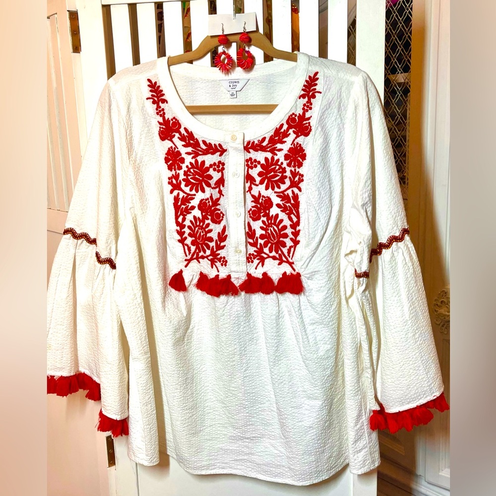 Cute seersucker white top with red trim, coordinating earring included.